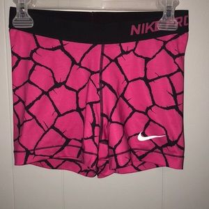 Pink and black nike pros